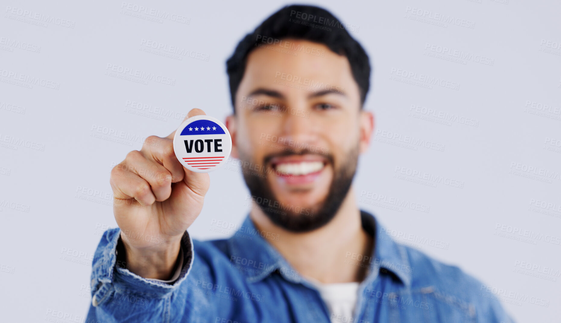 Buy stock photo Vote, smile and portrait of man with badge in studio for choice, decision or registration on grey background. Government, politics and face of happy voter with support, freedom and party election 