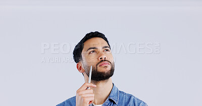 Buy stock photo Thinking, face and man with pen in studio looking up at mockup for brainstorming on grey background. Idea, questions and model with problem solving, planning or emoji for solution, guess or choice