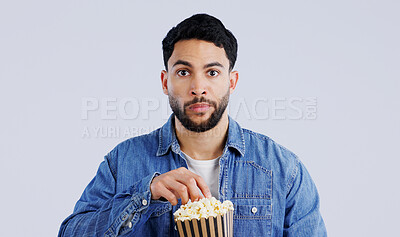 Buy stock photo Television, portrait and man with popcorn in studio for movie, film or documentary on grey background. Cinema, watching tv and face of model with theater snack for video, entertainment or streaming