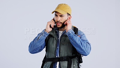 Buy stock photo Hiking, man and phone call service, frustrated and studio isolated on a white background mockup space. Person trekking, mobile and lost connection signal, confused and backpacker in communication