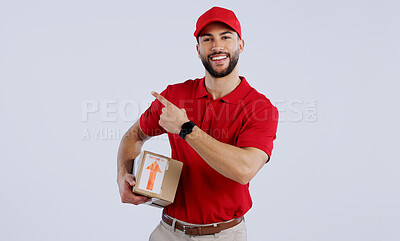 Buy stock photo Courier man, box and studio portrait with pointing, smile and happy for delivery, shipping or supply chain. Logistics expert, happy and cardboard package for commercial job with product by background