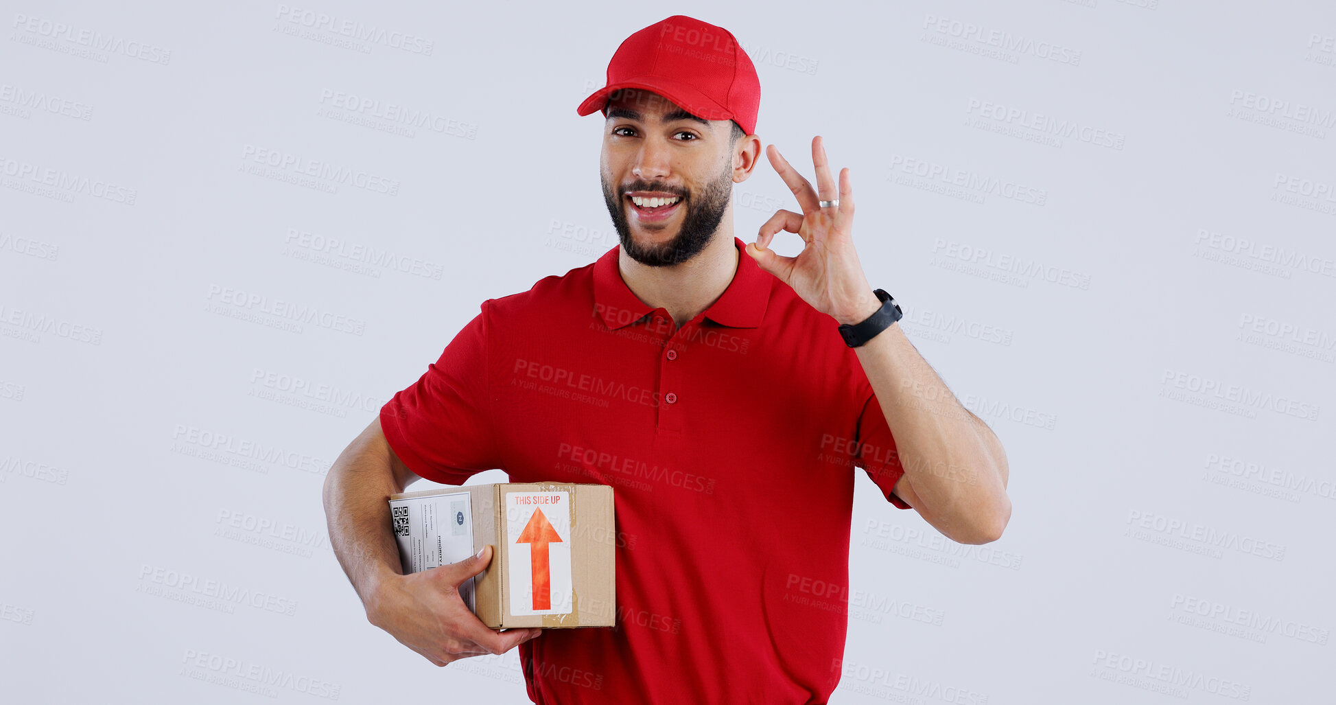 Buy stock photo Portrait, man and box with okay sign on studio for delivery, logistics and mockup for package on white background. Male model, worker or courier with gesture in Mexico for good, choice or decision