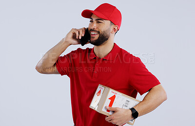 Man, delivery and phone for communication in studio for courier mock up on white background in Mexico. Male model, package or box with smile for conversation for logistics, parcel or order in space