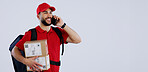 Delivery man, phone call and box in studio, space and mockup in talk for location, info or supply chain by background. Courier, smartphone and backpack with cardboard package, product and promotion
