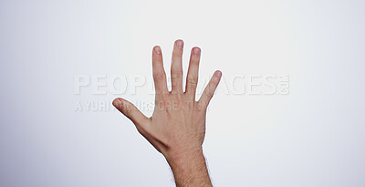 Hand, counting five and person in studio with mockup space for advertising, promotion or marketing. Fingers stop, hold up closeup and man model with mathematics numbers gesture for empty mock up by white background.