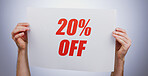 Hands, 20% discount rate and promotion sign at studio isolated on a white background. Poster, sales deal and special offer of price reduction, clearance advertising and marketing savings in retail shop