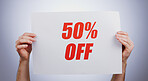 Hands, discount 50 percentage and advertising sign at studio isolated on a white background. Poster, sales deal and special offer of price reduction, half price 50% clearance promotion and marketing savings in retail
