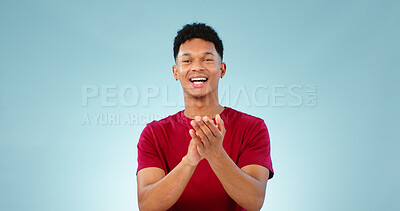 Buy stock photo Man, portrait and clapping for celebration in studio for goal growth, winning or opportunity. Male person, face and hand applause on blue background as mockup or achievement, congratulations or pride