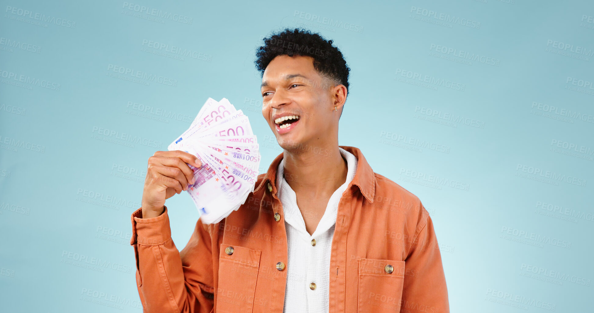 Buy stock photo Happy man, winner and money fan with success, bonus or winning, college loan or cashback ideas in studio. Excited student thinking of cash, savings or scholarship funding isolated on blue background