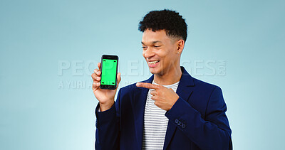 Buy stock photo Business man, phone green screen and presentation for stock market, trading software or registration in studio. Young trader pointing to mobile app or website mockup isolated on a blue background