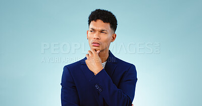 Buy stock photo Man, thinking with idea in studio or decision and planning problem solving by blue background. Young, brazil and person in thought for creative solution, project insight and choice by mock up space