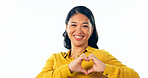 Portrait, love and heart hands with a young asian woman isolated on a white background in studio for health or wellness. Face, romance and satisfaction with a happy young person on valentines day