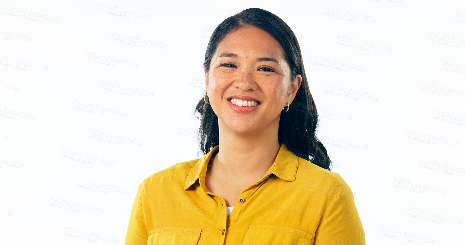 Buy stock photo Portrait, smile and a young asian woman isolated on a white background in studio looking confident or positive. Face, happy and satisfaction with a korean girl in a casual clothes outfit for fashion