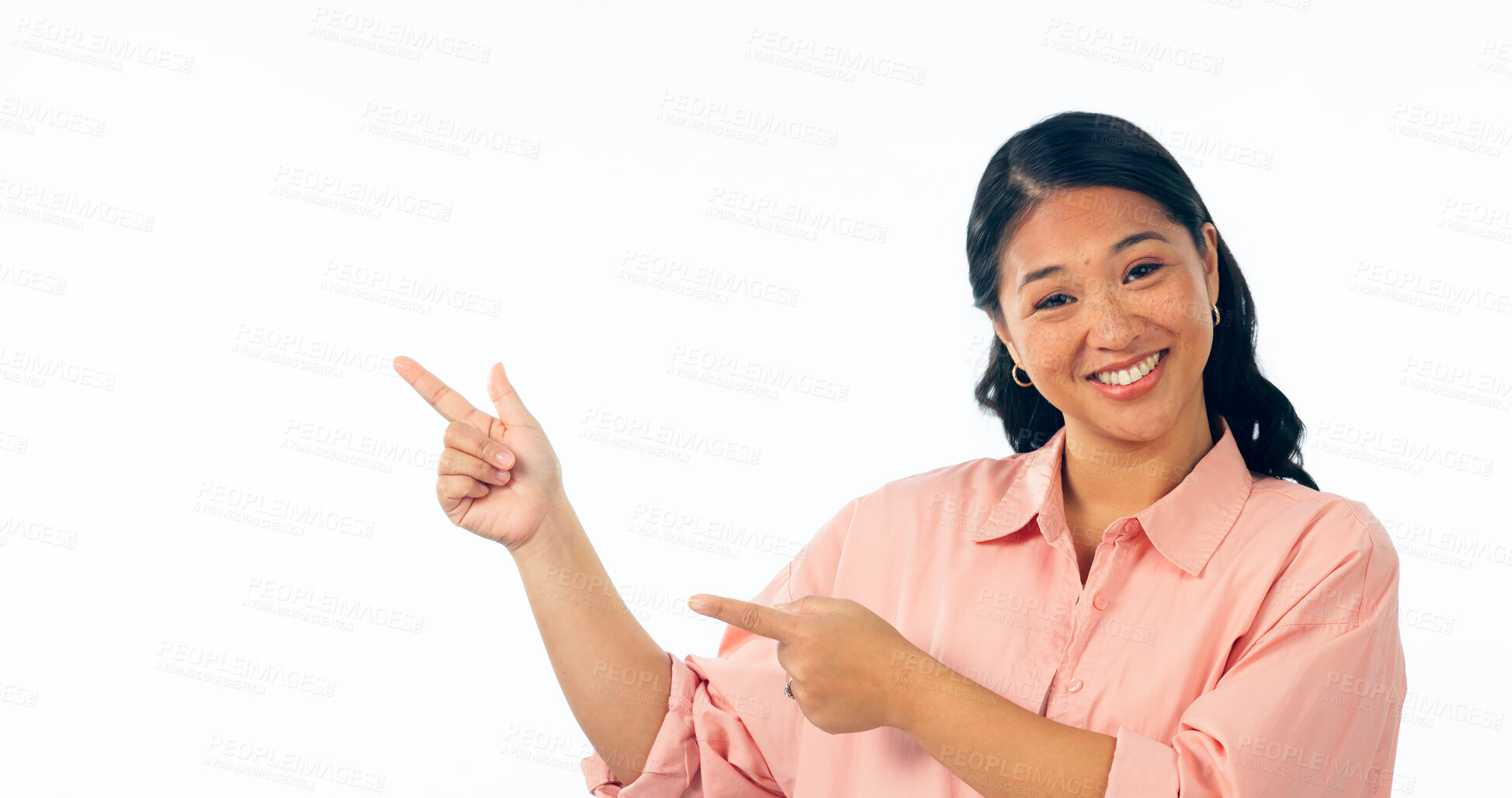 Buy stock photo Portrait, pointing and woman with a smile, opportunity and announcement isolated on white studio background. Face, person or model with hand gesture, mockup space and news with happiness or promotion