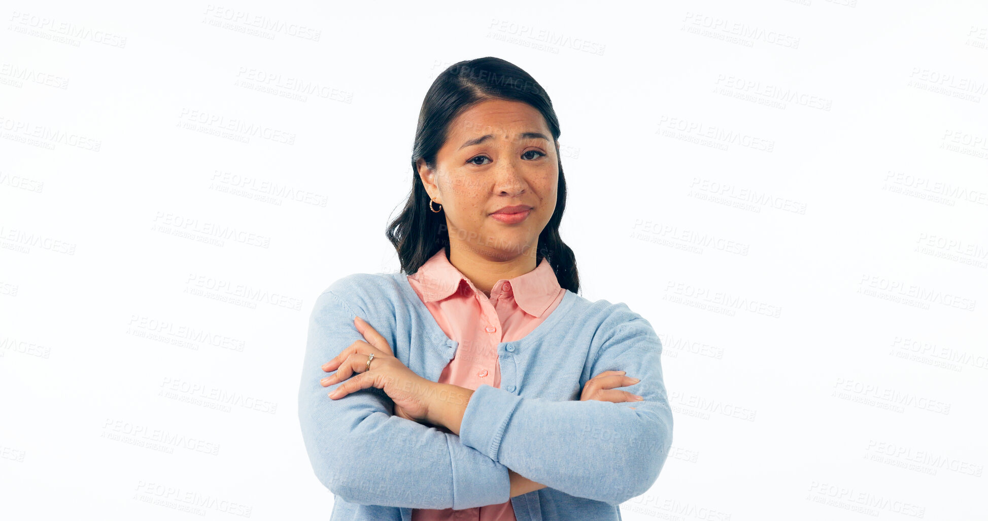 Buy stock photo Portrait, attitude and an asian woman arms crossed in studio isolated on a white background for rejection. Angry, frustrated or deny with an unhappy young person looking moody, negative or annoyed