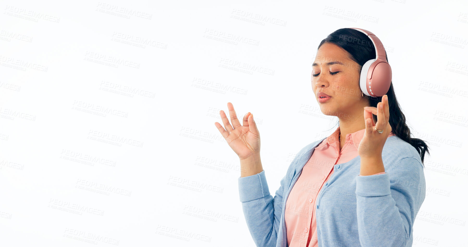 Buy stock photo Woman, meditation and headphones, listening to calm audio, podcast and peace in studio on banner mockup. Asian person with music subscription for yoga, lotus hands or zen isolated on white background