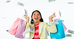 Shopping bag, money rain and woman or winner celebration for giveaway, winning and competition in studio. Portrait of excited asian customer with gift and cash in air isolated on a white background