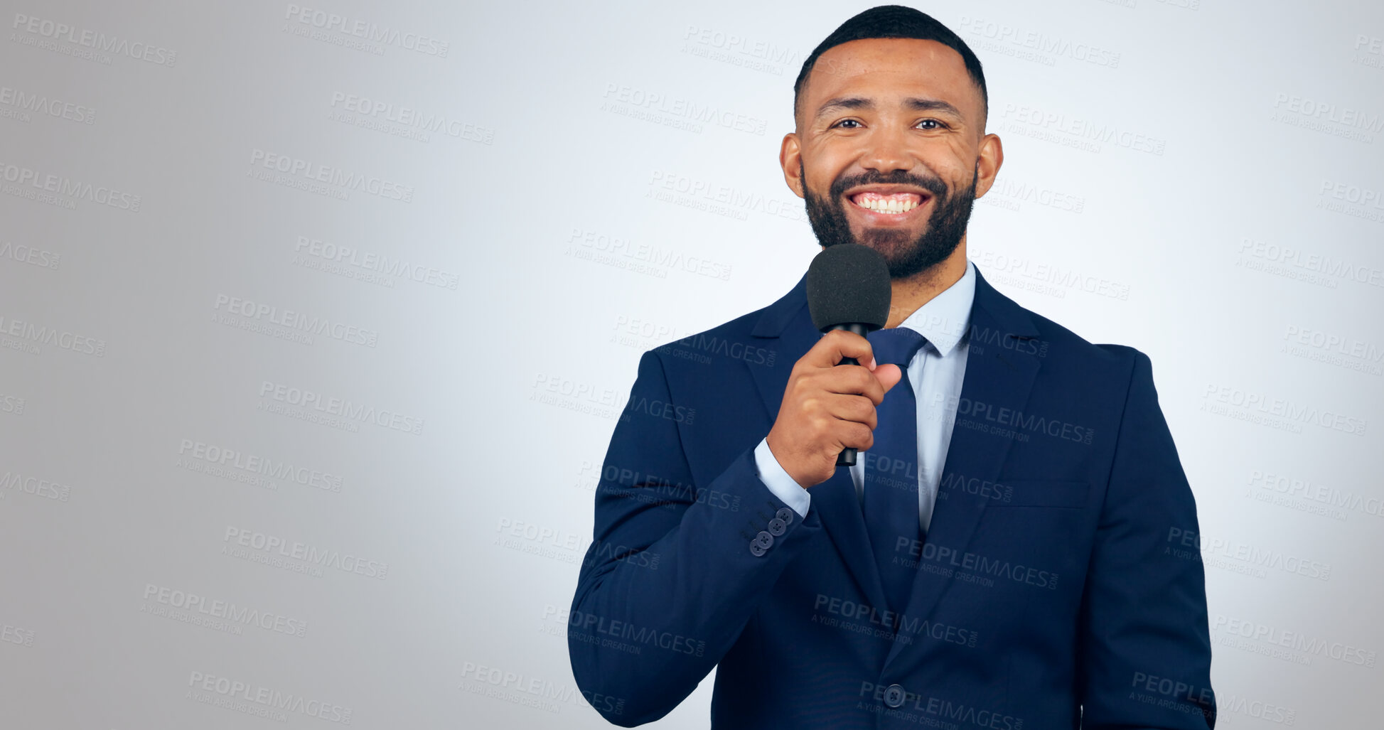 Buy stock photo Portrait, microphone and corporate businessman in studio with smile, pride and professional news anchor. Happy man, reporter or broadcast journalist with mic on white background with mock up space.