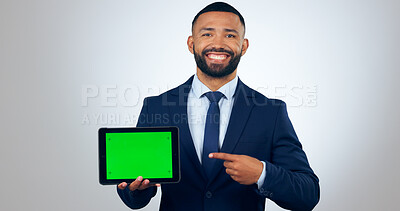 Buy stock photo Tablet, green screen and portrait of business man in studio for internet, website promotion and social media. Corporate, professional and person on digital tech for networking on gray background