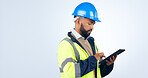 Man, tablet and typing online for engineering, project management and construction update in studio. Industry worker with digital technology for blueprint or architecture plan on a white background