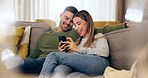 Relax, phone and couple on sofa for social media, internet and reading funny website together. Dating, home and man and woman on smartphone laugh for meme and bonding, happy and love in living room