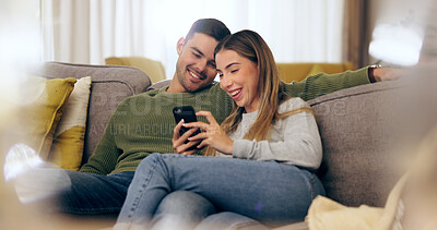 Buy stock photo Relax, phone and couple on sofa for social media, internet and reading funny website together. Dating, home and man and woman on smartphone laugh for meme and bonding, happy and love in living room