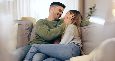 Buy stock photo Happy couple, in love and together on sofa in living room for eye contact, trust or bonding. Man, woman and married with embrace for hug in romance, care or comfort in connection on honeymoon in home