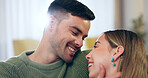 Love, smile and young couple in living room bonding at apartment on a romantic date with intimate moment. Happy, positive and man and woman from Canada on a sofa with romance together at modern home.