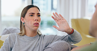 Buy stock photo Woman, fight and divorce on sofa in home with discussion, talking or upset with spouse for cheating. Female person, wife and gesture in stop for lies of infidelity, conflict or problem in living room