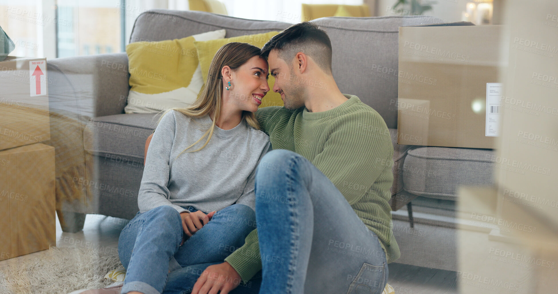 Buy stock photo Happy couple, boxes and new home at sofa for dream house, living room or property. Man, woman and forehead embrace at couch for achievement smile or apartment change for milestone, talking or relax