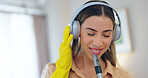 Woman, headphones and cleaning house or music, smile and streaming radio or audio, sound and song. Happy female person, sweeping and karaoke at home, freedom and housekeeping or podcast for hygiene