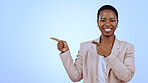 Woman, portrait and pointing for announcement in studio with smile, presentation or advertising space. Black person, face and smile for business, showing deal or discount with hand and joy on mockup