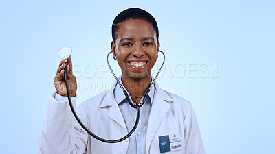 Buy stock photo Happy woman, doctor and stethoscope for healthcare in studio of blue background for mock up in medicine. Portrait, black person and medical professional with smile for wellness, lungs and breathing