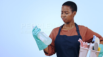 Buy stock photo Woman, holding detergent and thinking for cleaning service, housekeeping or home improvement on blue background. Black person, face and liquid product with bucket, container or doubt on mock up space