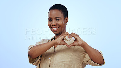 Buy stock photo Heart, hands and portrait of black woman in studio for kindness, care and charity donation on blue background. Happy model show sign of love, hope and thank you for support, emoji and review of peace