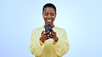Happy woman, smile or texting on mobile app in studio for mockup of social media on blue background. Black person, face and looking at screen for email, message or reading on internet, online or web