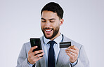 Business man, credit card and phone for online shopping, e commerce or digital payment in studio. Professional worker typing on his mobile for internet banking or debit isolated on a white background