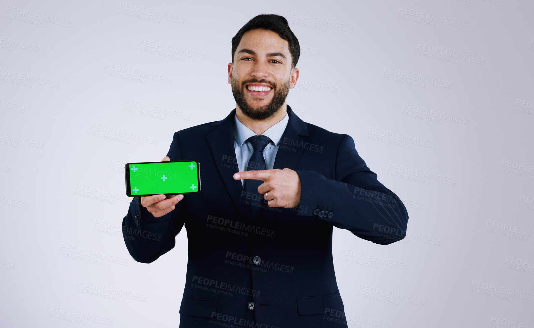 Buy stock photo Professional man, phone green screen and presentation for website, corporate software or job registration in studio. Portrait of business worker pointing to mobile app or mockup on a white background