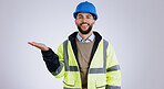 Happy man, portrait and architect with palm for advertising or marketing against a gray studio background. Male person, contractor or engineer smile with hand out for deal or service in construction