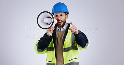 Buy stock photo Angry man, architect and pointing with megaphone for construction or protest against a gray studio background. Portrait of male person, contractor or engineer shouting or screaming on loudspeaker