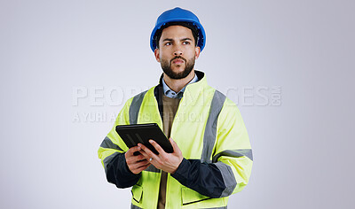 Buy stock photo Man, architect and thinking with tablet for construction or planning against a gray studio background. Male person, contractor or engineer in wonder, thought or plan with technology for architecture