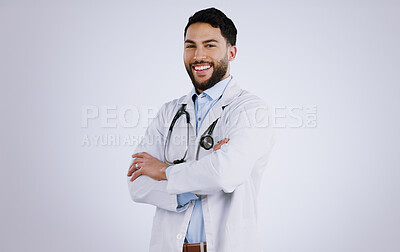 Buy stock photo Happy man, portrait and professional doctor with arms crossed against a gray studio background. Male person, medical or healthcare expert standing in confidence with smile for health and wellness