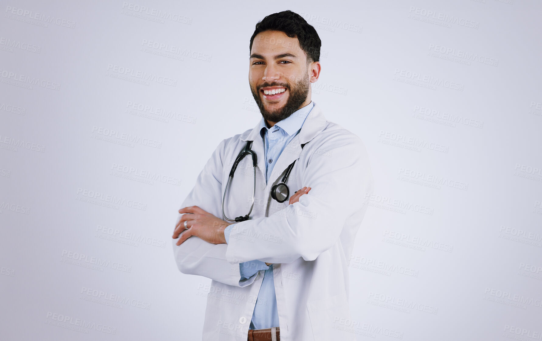 Buy stock photo Happy man, portrait and professional doctor with arms crossed against a gray studio background. Male person, medical or healthcare expert standing in confidence with smile for health and wellness