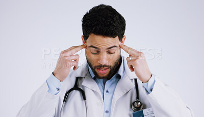 Buy stock photo Man, doctor and headache in stress, anxiety or burnout for overworked against a white studio background. Male person, medical surgeon or nurse with migraine in depression, mental health or pressure
