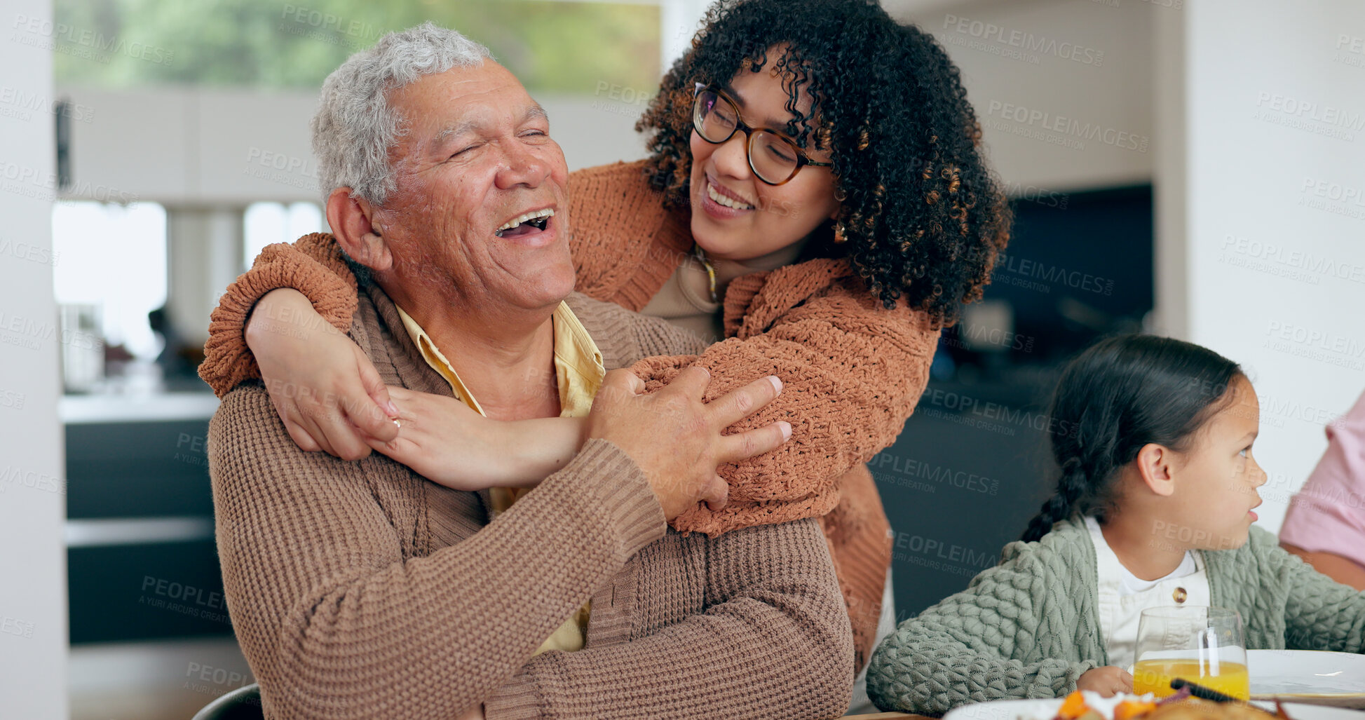 Buy stock photo Senior, man and daughter with hug for love, laughing and joke in dining room of home with happiness. Family, dad and woman with embrace, smile and care for relaxing, peace and comic in lounge