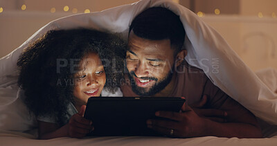 Buy stock photo Dad, daughter or tablet at night and internet for movie, cartoon or streaming with blanket on bed in bedroom. Family, man or girl child with technology in the dark for film, video and bonding in home