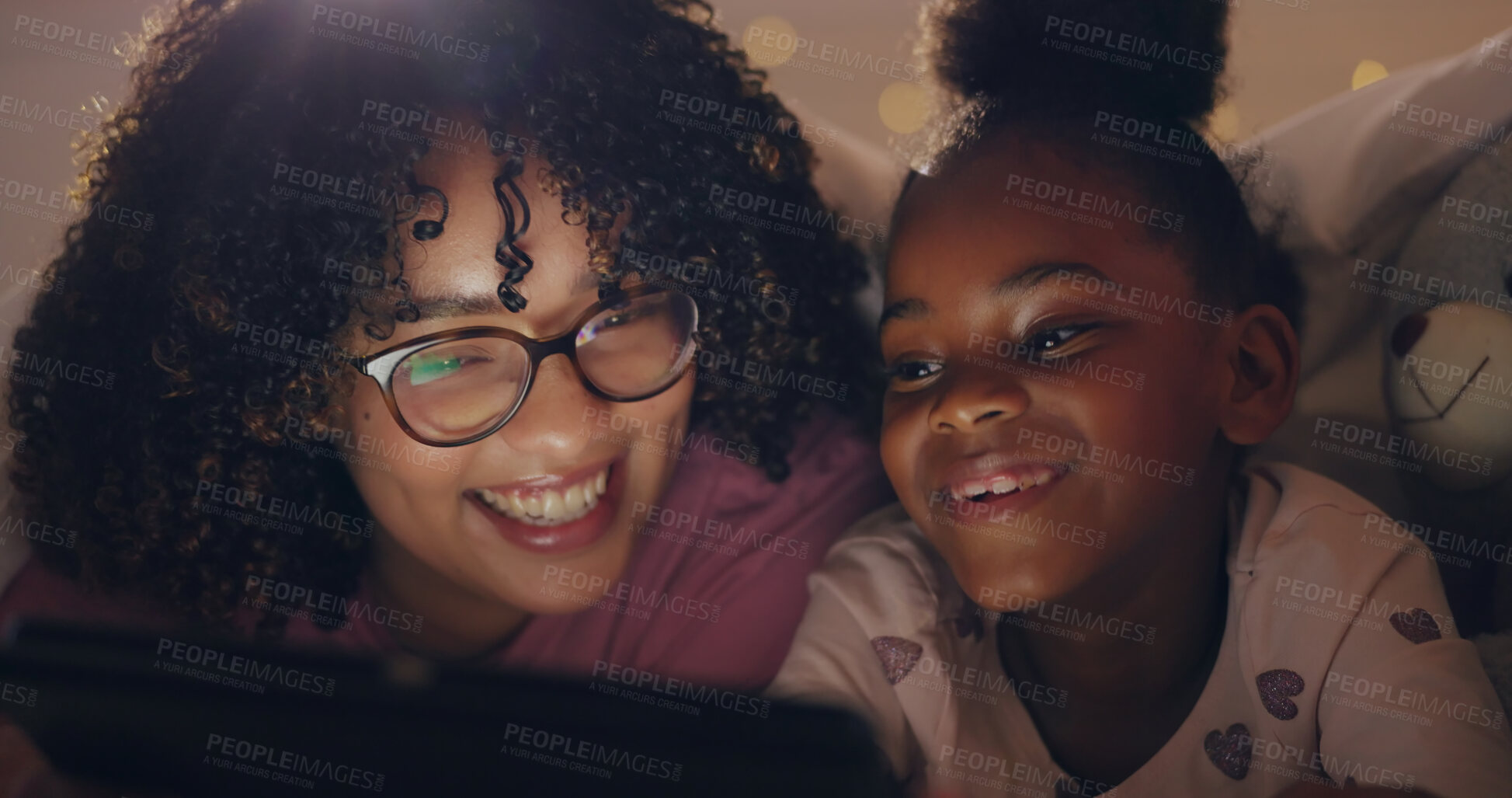 Buy stock photo Mom, daughter and tablet at night with internet for movie, cartoon or streaming with blanket on bed in bedroom. Family, woman and girl child with technology in the dark for film, video and bonding