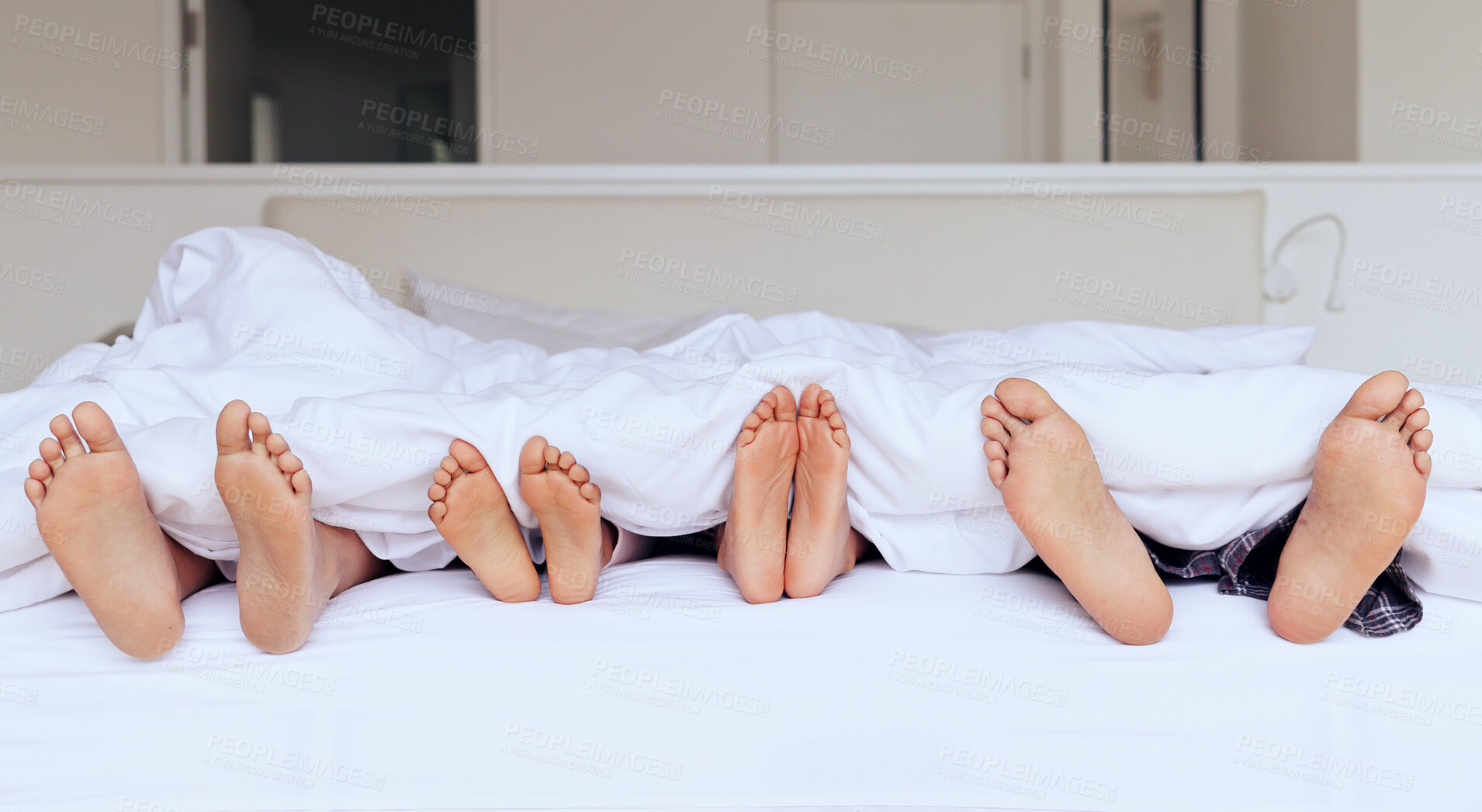 Buy stock photo Family, feet and bed with blanket for sleeping, relaxing or rest together with calm and peace in home. People, parents and children with duvet in morning on vacation, holiday or hotel on weekend