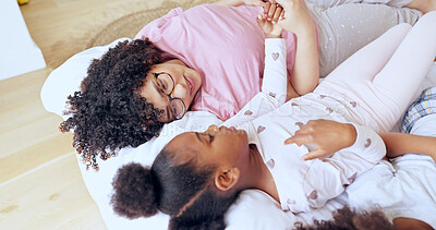 Buy stock photo Mother, daughter and bonding on bed with relax, peace and happiness in bedroom of family home in morning. People, woman or girl child together with pyjamas for rest, love and care with smile in house