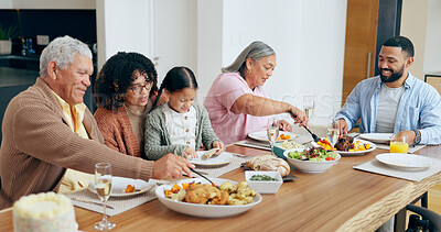 Buy stock photo Happy family, food and smile in dining room of home for dinner, lunch or event for bonding and care. People, parents and grandparents with child at table in lounge for celebration, love and smile